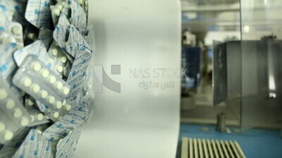 Stage of assembling the drug strips after packaging and pressing them