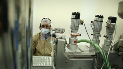 Man in a medicine factory from inside