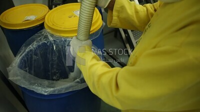 Specialist makes sure that all the tablets are crushed into a powder
