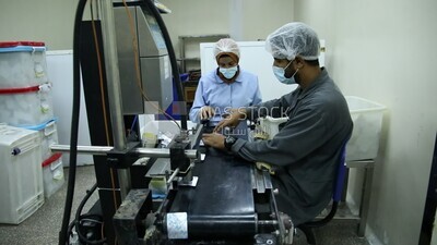 Two doctors ensure the safety and quality of the Medication tablets and then fill them in the designated boxes