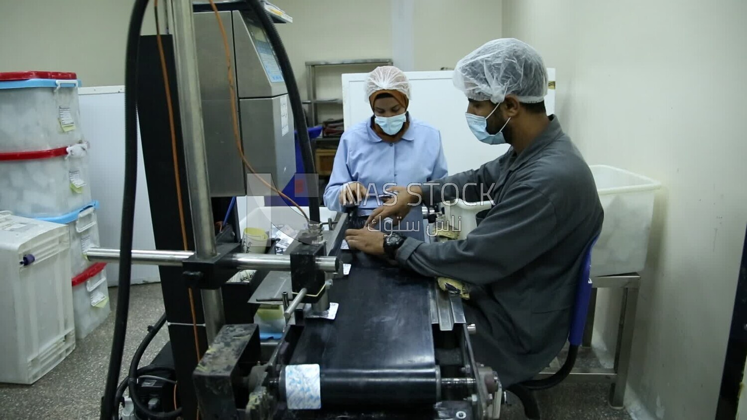 Two doctors ensure the safety and quality of the Medication tablets and then fill them in the designated boxes