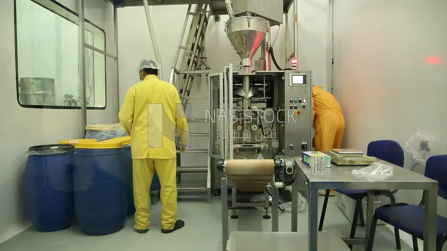 Two men in a medicine factory from inside