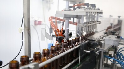 Stage of filling the drug into bottles in a pharmaceutical factory