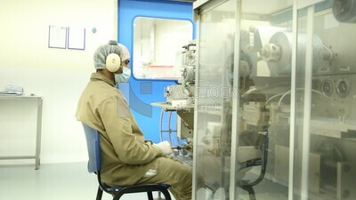 Man in a medicine factory from inside