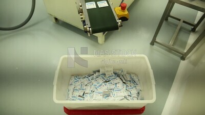 Stage of collecting the effervescent drug bags to ensure that they are transferred to the packaging stage