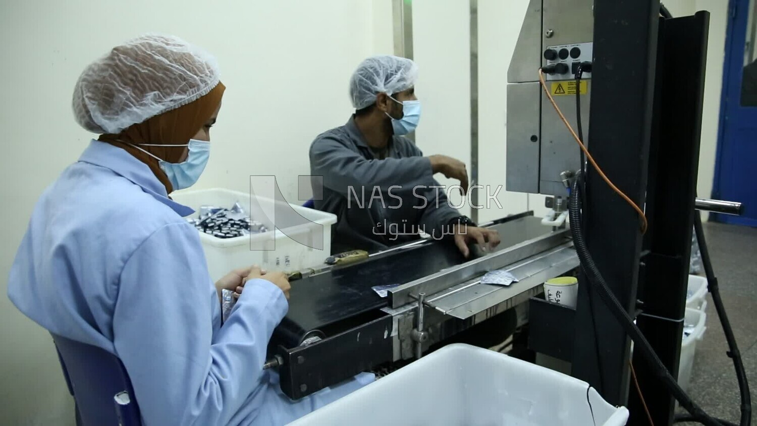 Workers in a pharmaceutical factory