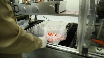 Specialist who removes invalid Medication tablets from the manufacturing stage