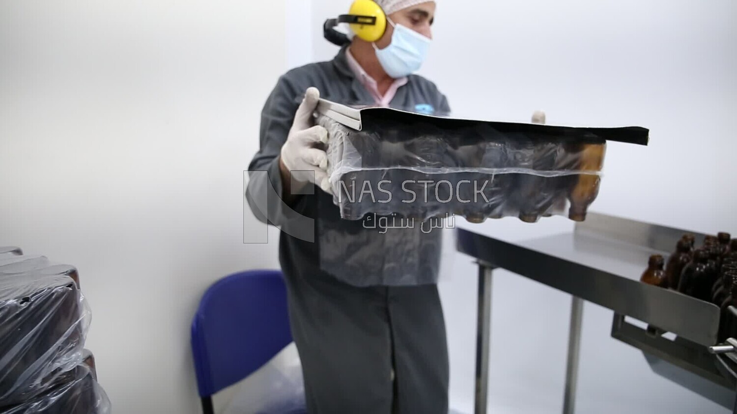 Specialist opens a new set of bottles to be used in packing medicines