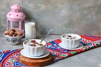Two bowls of dates milk, healthy and useful juice, ramadan juice.
