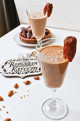 Two cups of dates milk, healthy and useful juice, ramadan juice