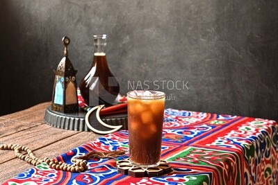 Cup of licorice juice with ice, ramadan juice