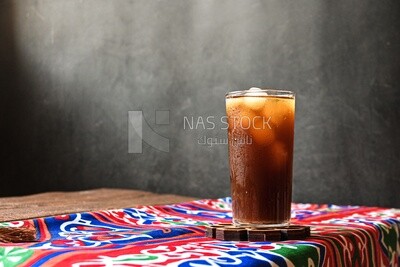 Cup of licorice juice with ice, ramadan juice