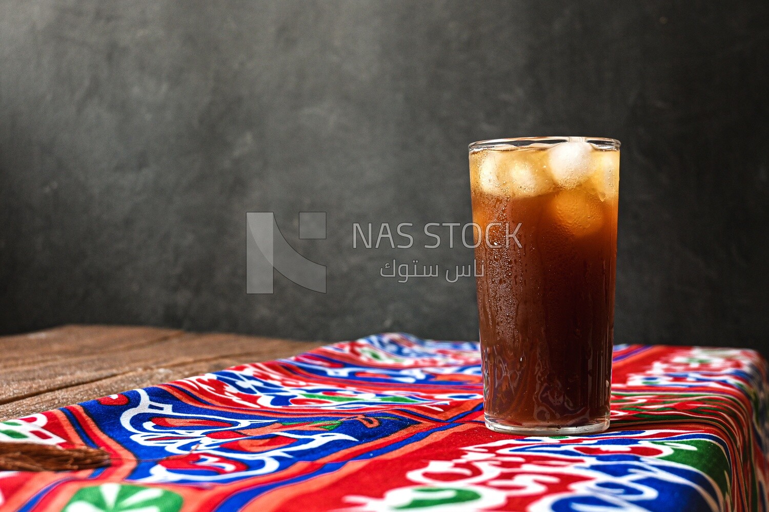 Cup of licorice juice with ice, ramadan juice