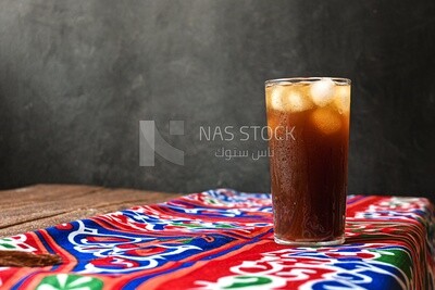 Cup of licorice juice with ice, ramadan juice