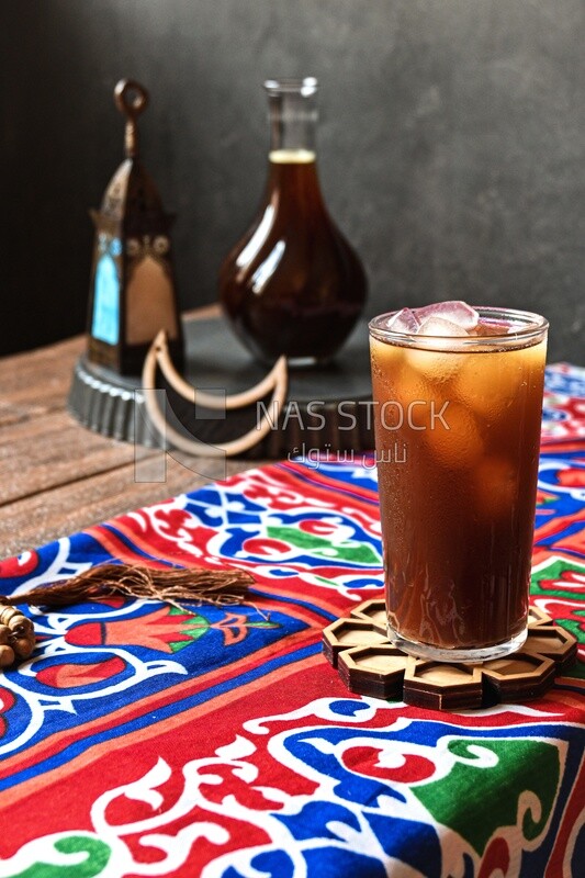 Cup of licorice juice with ice, ramadan juice