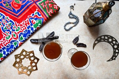 Two cups of carob with carob sticks, cold drinks, delicious natural juices, healthy and useful juice