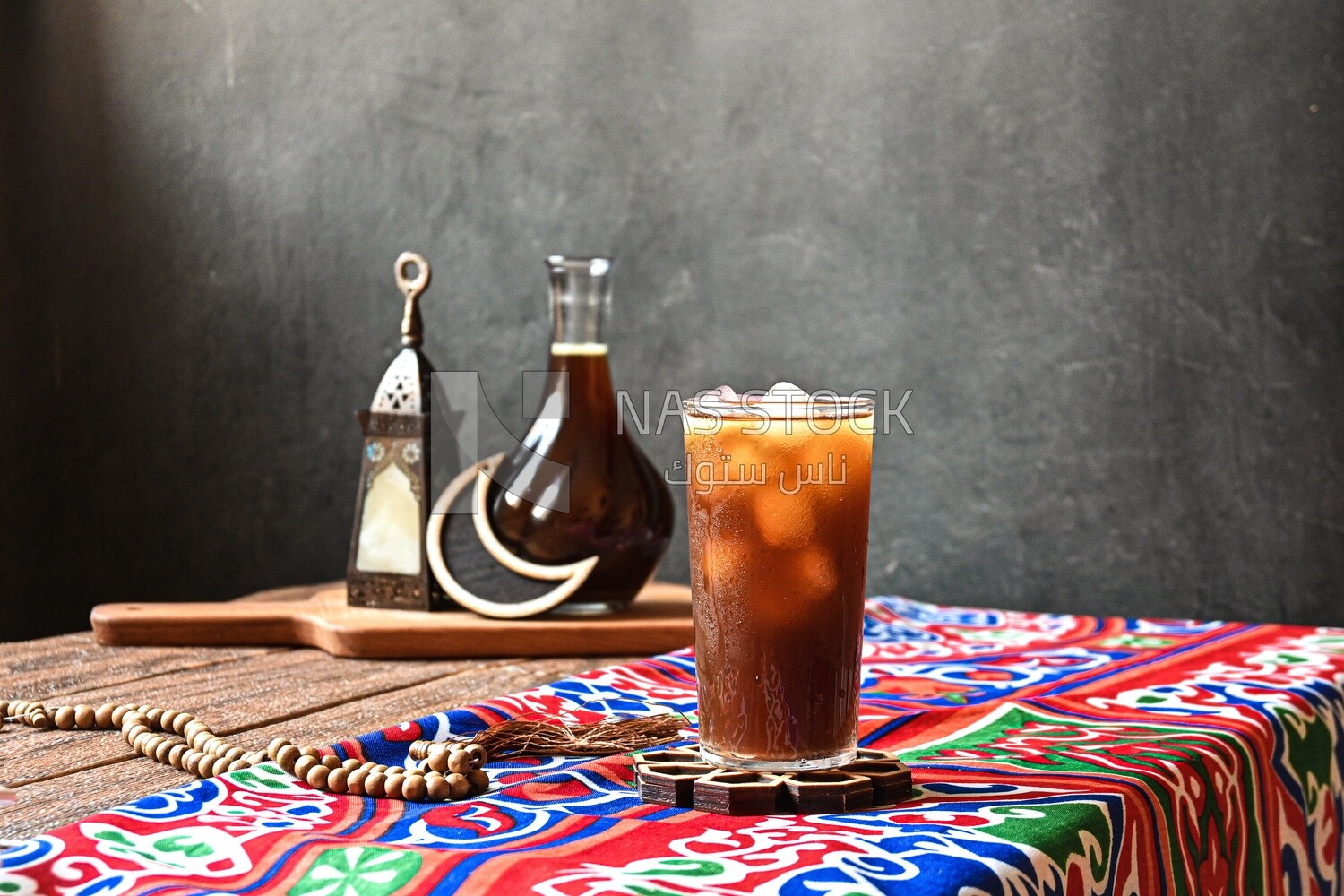 Cup of licorice juice with ice, ramadan juice