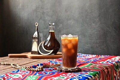 Cup of licorice juice with ice, ramadan juice
