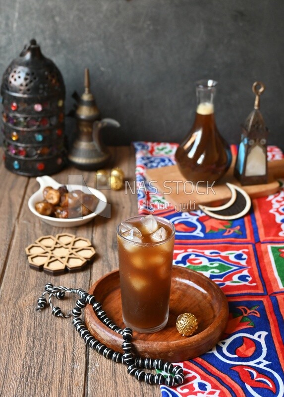 Cup of licorice juice with ice, ramadan juice