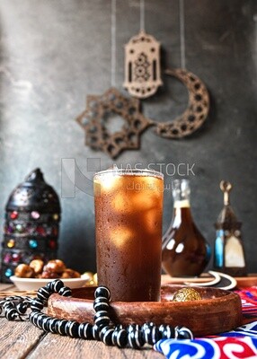 Cup of licorice juice with ice, ramadan juice