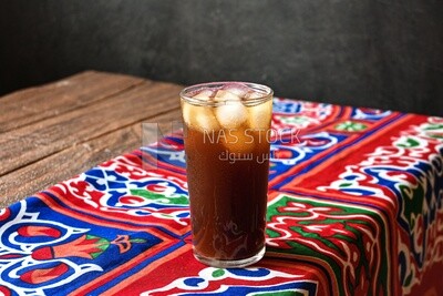 Cup of licorice juice with ice, ramadan juice