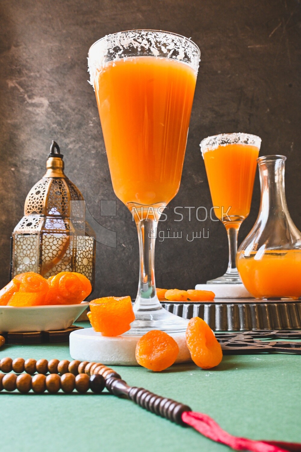 Two cups of Qamar Al Deen juice with dried apricots, Ramadan juice