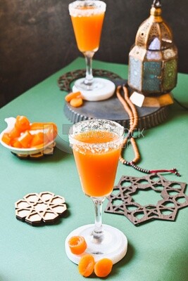 Two cups of Qamar Al Deen juice with dried apricots, Ramadan juice