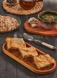 Plate of Molokhia, white rice, and crispy Phyllo Meat Pie (Egyptian goulash), traditional Arabic dishes, Arabic food, popular dishes, delicious recipes and dishes, delicious food