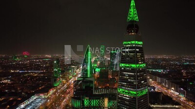 drone footage of  Al-Faisaliah Tower in Riyadh, the towers on King Fahd Road, famous towers in Riyadh, saudi national day, green lights