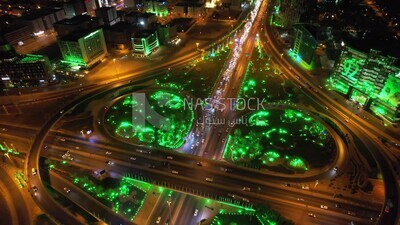 drone footage of car traffic on the highway in Riyadh,  tourism in Saudi Arabia, Saudi Arabia at night, Saudi national day, Cairo Square, Riyadh roads and streets, green lights