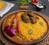 Wooden plate of delicious biryani rice with meat,  traditional Arabic dishes, Arabic food, popular dishes, delicious recipes and dishes, delicious food