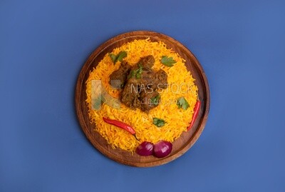 Wooden plate of delicious biryani rice with meat,  traditional Arabic dishes, Arabic food, popular dishes, delicious recipes and dishes, delicious food