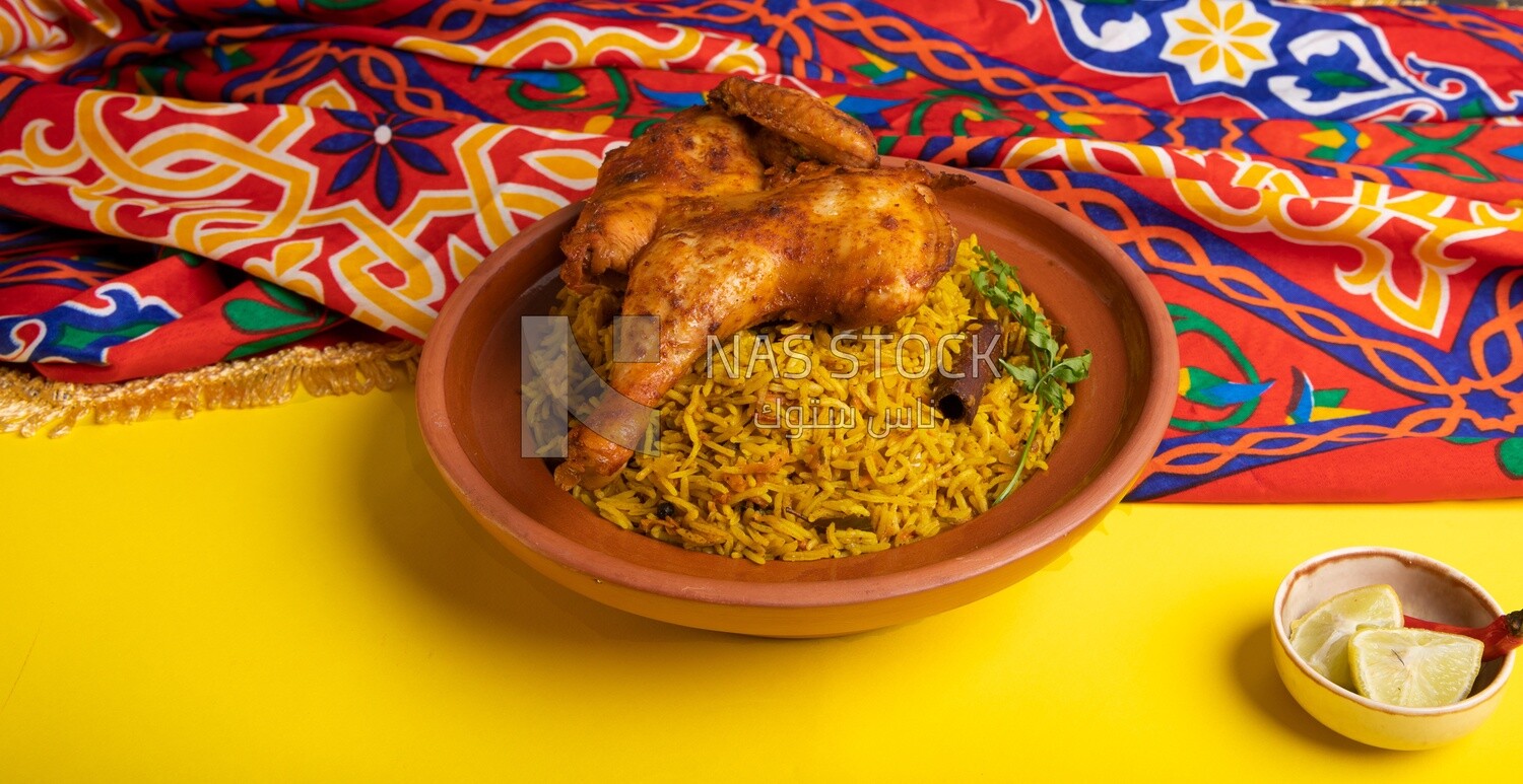 Plate of kabsa rice with chicken, traditional Saudi food, Saudi restaurant, Saudi dishes