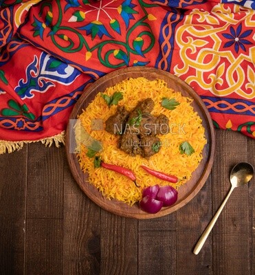 Wooden plate of delicious biryani rice with meat,  traditional Arabic dishes, Arabic food, popular dishes, delicious recipes and dishes, delicious food