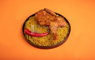 Plate of kabsa rice with chicken, traditional Saudi food, Saudi restaurant, Saudi dishes