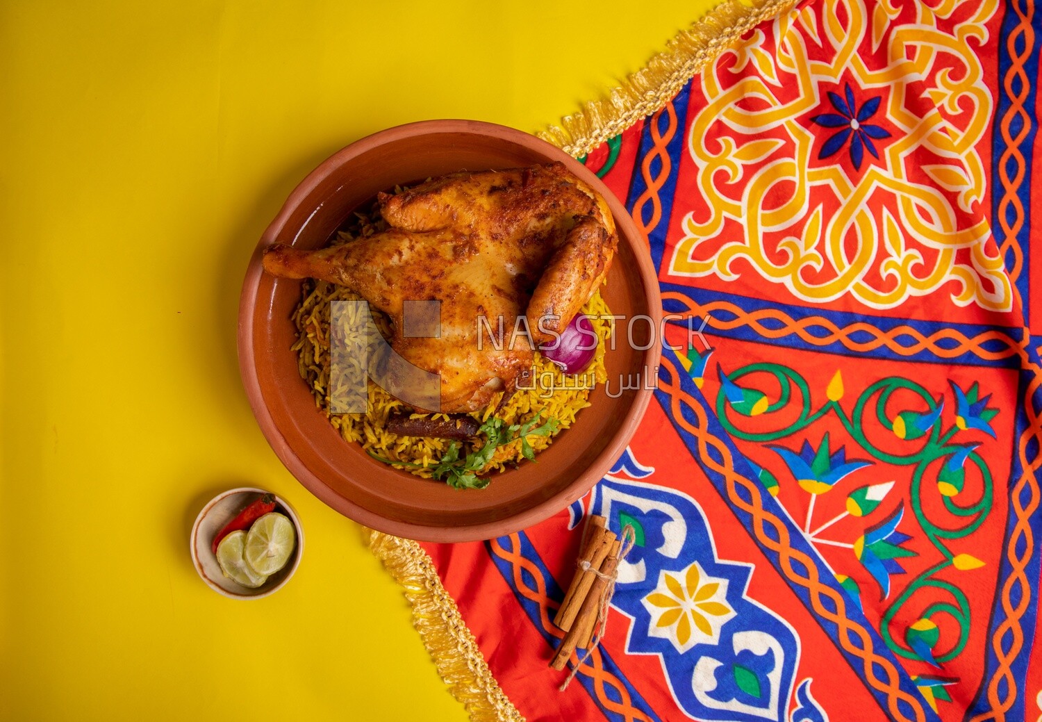 Plate of kabsa rice with chicken from the top, traditional Saudi food, Saudi restaurant, Saudi dishes