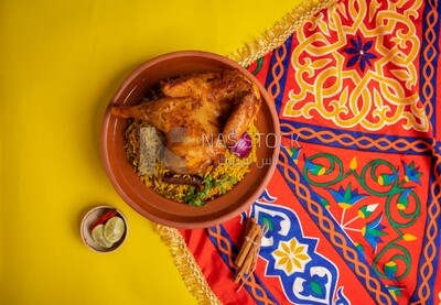Plate of kabsa rice with chicken from the top, traditional Saudi food, Saudi restaurant, Saudi dishes