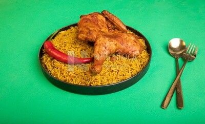 Plate of kabsa rice with chicken, traditional Saudi food, Saudi restaurant, Saudi dishes