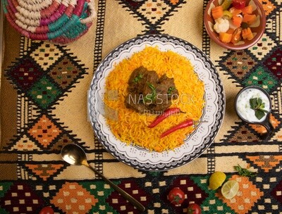 Wooden plate of delicious biryani rice with meat,  traditional Arabic dishes, Arabic food, popular dishes, delicious recipes and dishes, delicious food