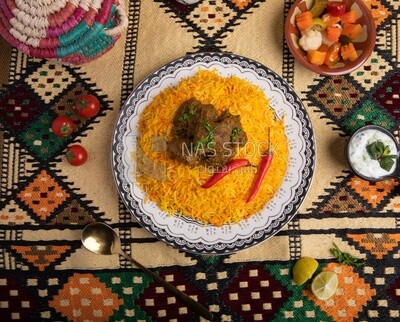 Wooden plate of delicious biryani rice with meat,  traditional Arabic dishes, Arabic food, popular dishes, delicious recipes and dishes, delicious food