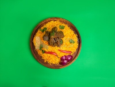 Wooden plate of delicious biryani rice with meat,  traditional Arabic dishes, Arabic food, popular dishes, delicious recipes and dishes, delicious food