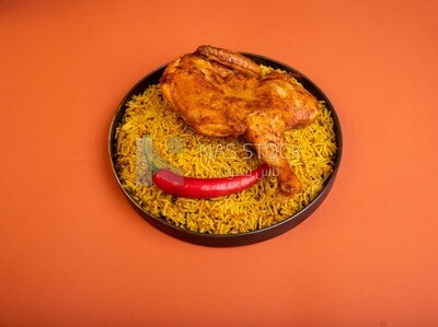 Plate of kabsa rice with chicken, traditional Saudi food, Saudi restaurant, Saudi dishes