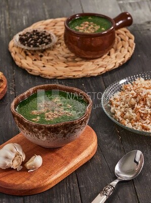 Plate of Molokhia and white rice, traditional Arabic dishes, Arabic food, popular dishes, delicious recipes and dishes, delicious food