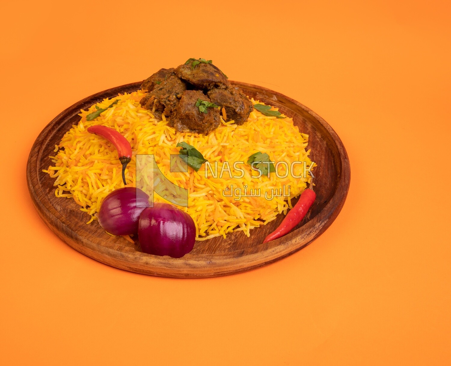 Wooden plate of delicious biryani rice with meat,  traditional Arabic dishes, Arabic food, popular dishes, delicious recipes and dishes, delicious food