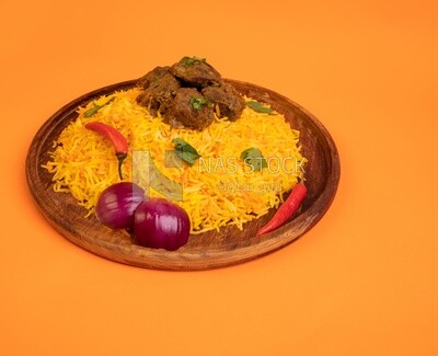 Wooden plate of delicious biryani rice with meat,  traditional Arabic dishes, Arabic food, popular dishes, delicious recipes and dishes, delicious food