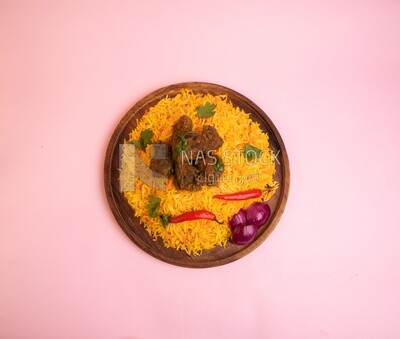 Wooden plate of delicious biryani rice with meat,  traditional Arabic dishes, Arabic food, popular dishes, delicious recipes and dishes, delicious food