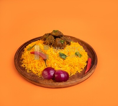 Wooden plate of delicious biryani rice with meat,  traditional Arabic dishes, Arabic food, popular dishes, delicious recipes and dishes, delicious food