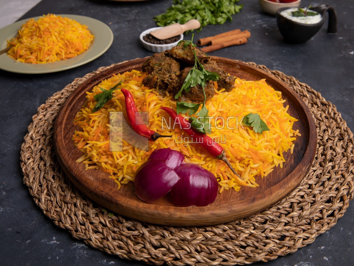 Wooden plate of delicious biryani rice with meat,  traditional Arabic dishes, Arabic food, popular dishes, delicious recipes and dishes, delicious food