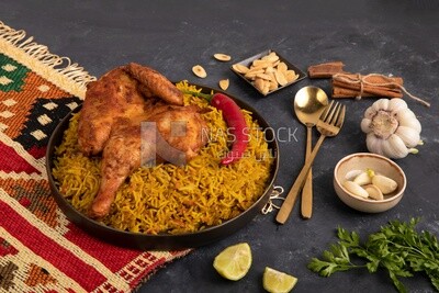 Plate of kabsa rice with chicken, traditional Saudi food, Saudi restaurant, Saudi dishes