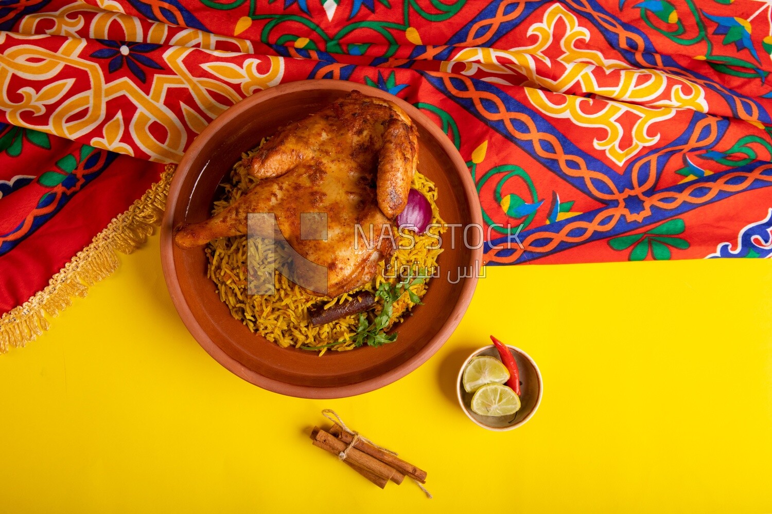 Plate of kabsa rice with chicken from the top, traditional Saudi food, Saudi restaurant, Saudi dishes